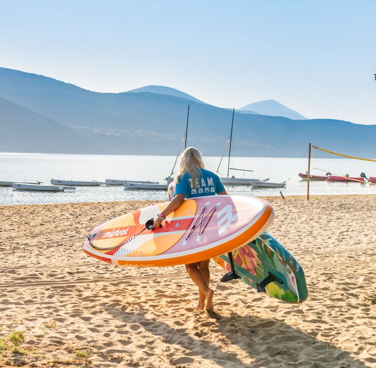 Happy people doing activities on a beach in Greece