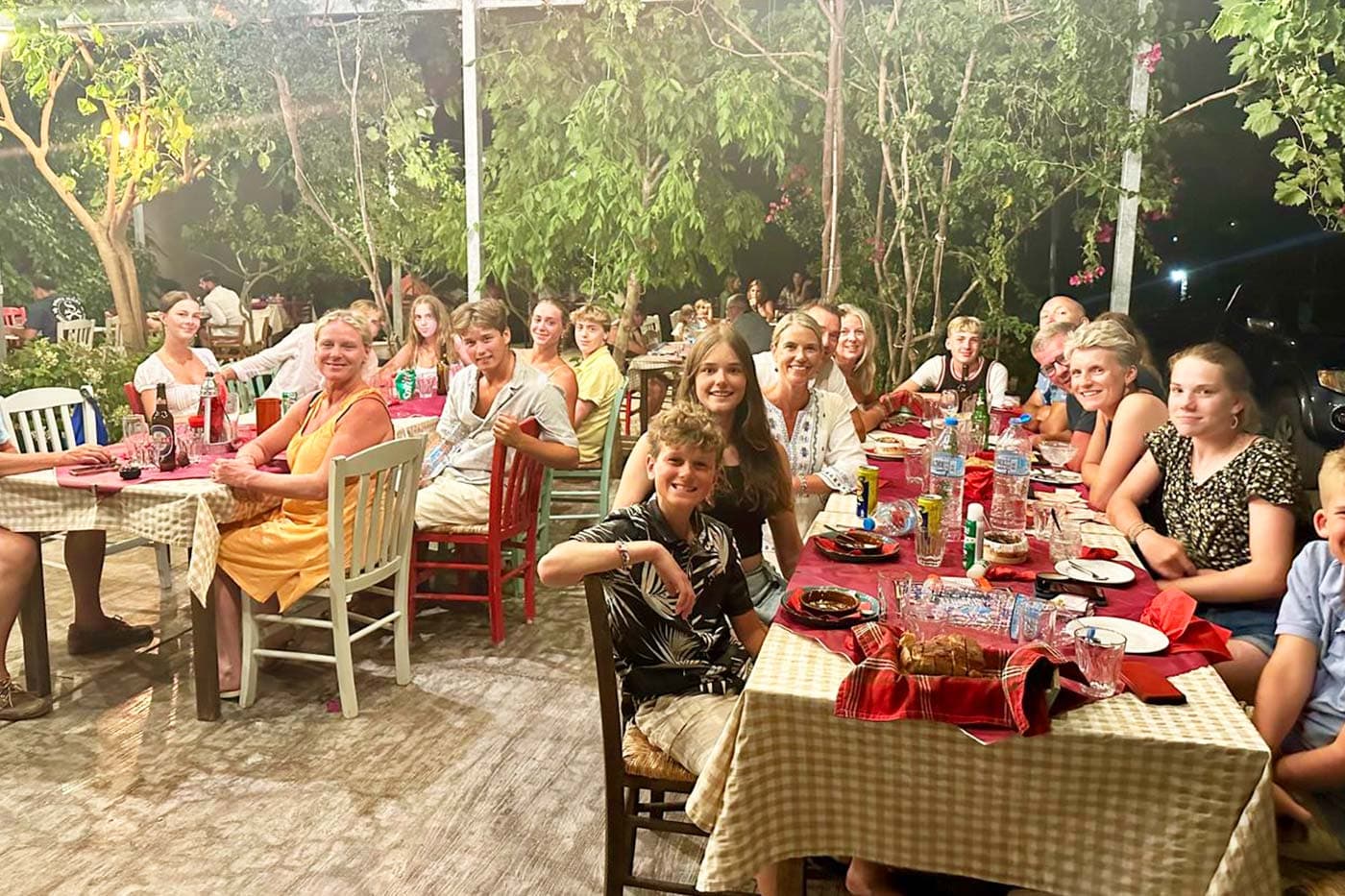 Flotilla crews sharing a long dinner at a Greek taverna