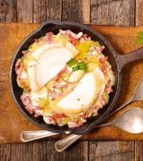 Tartiflette in a cast-iron skillet, a Savoyard chalet dinner classic
