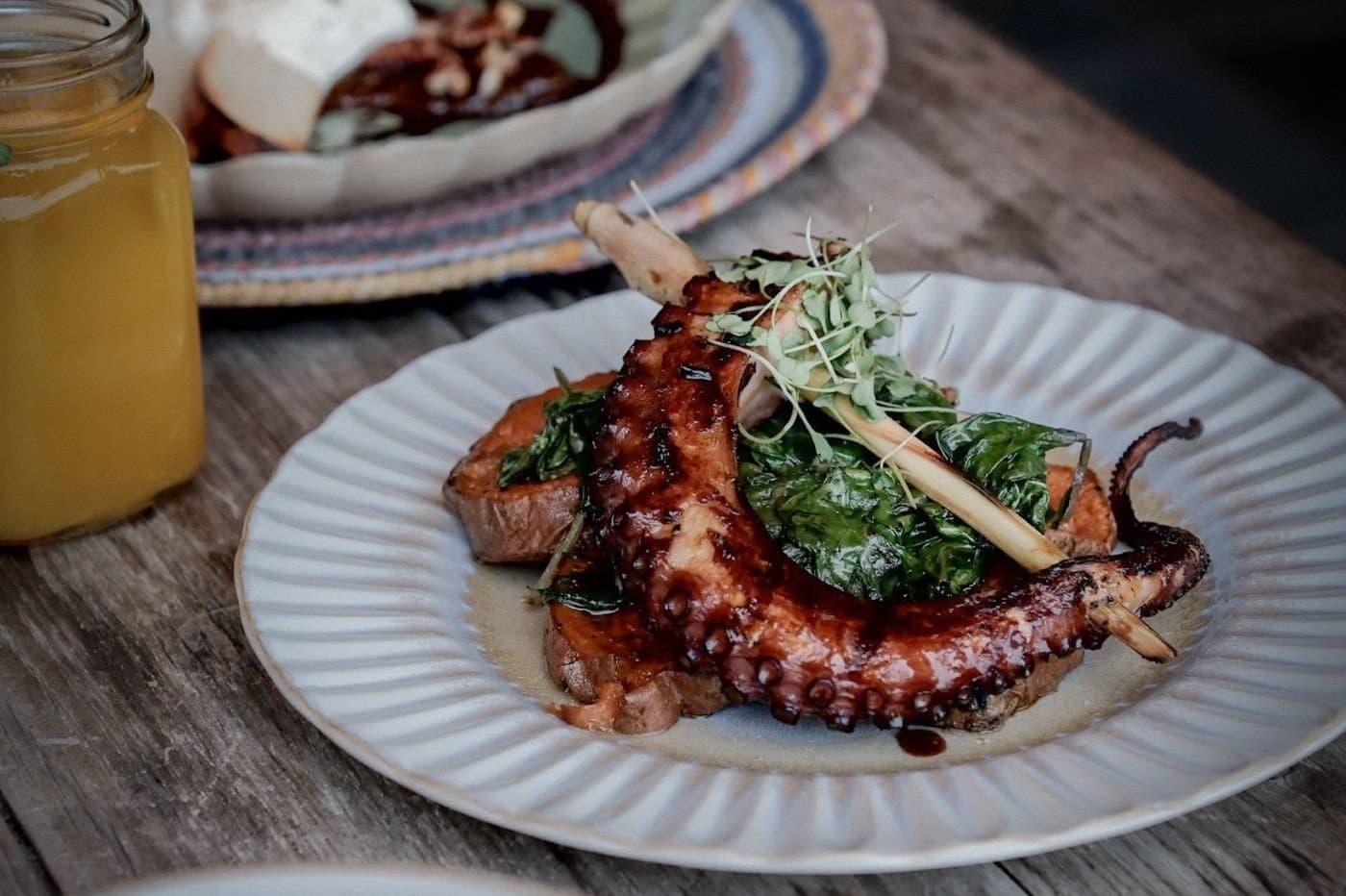 Grilled Portuguese octopus plated with local vegetables