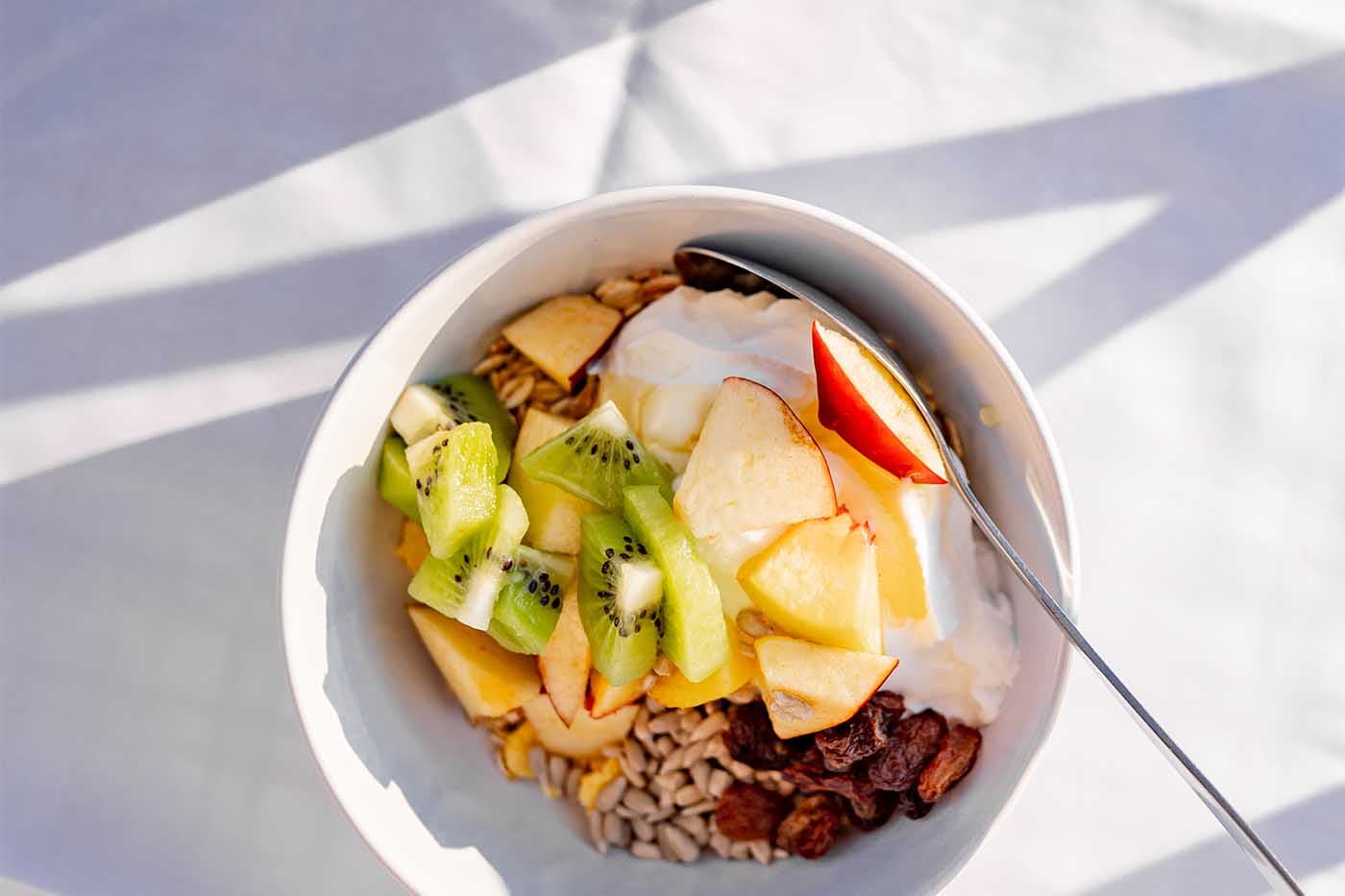 Breakfast bowl with fresh fruit, granola and yogurt served during a Beach Clubs holiday in Kefalonia, Greece.