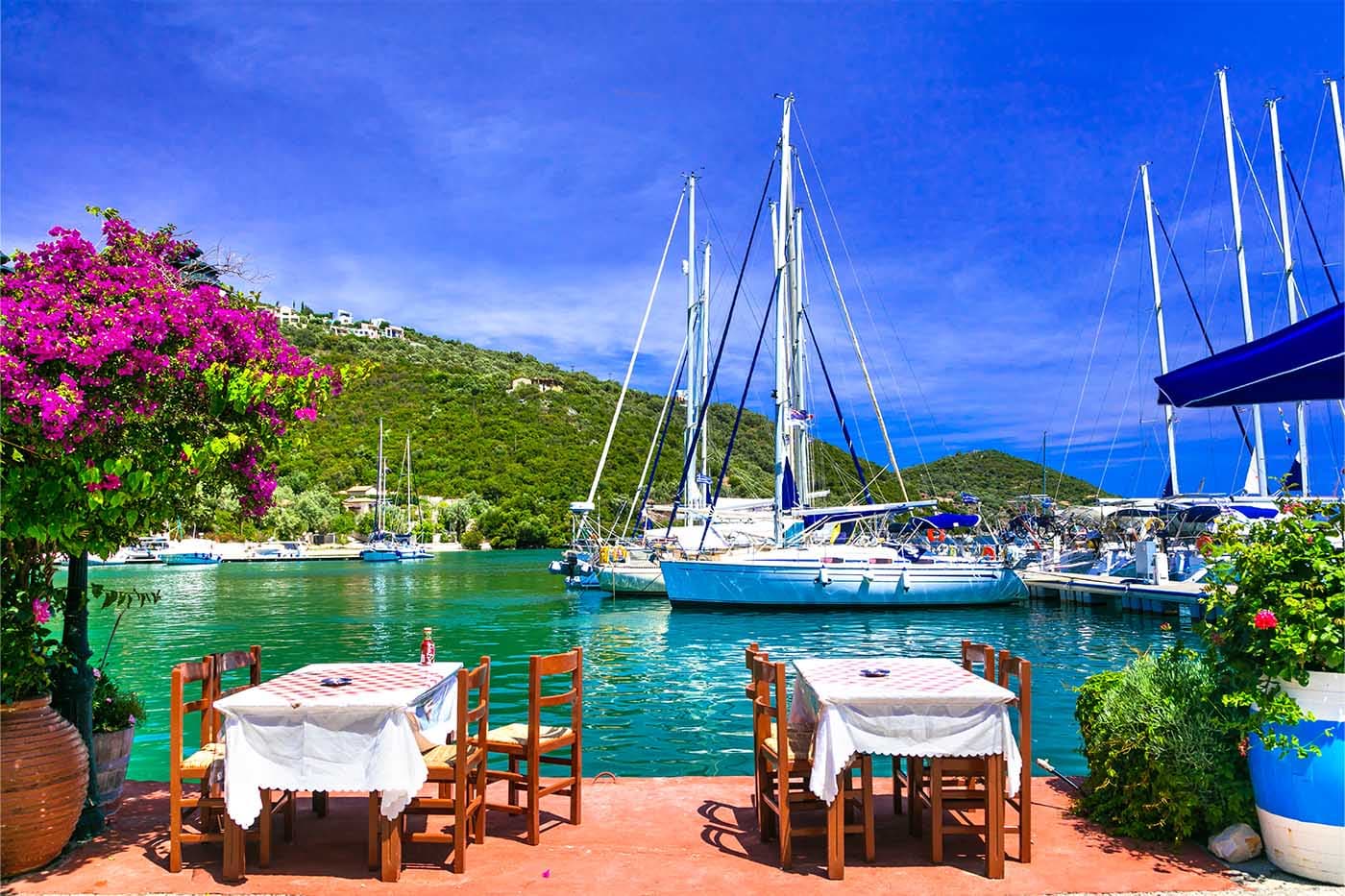 Harbourside taverna in Sivota, Lefkas with yachts moored opposite